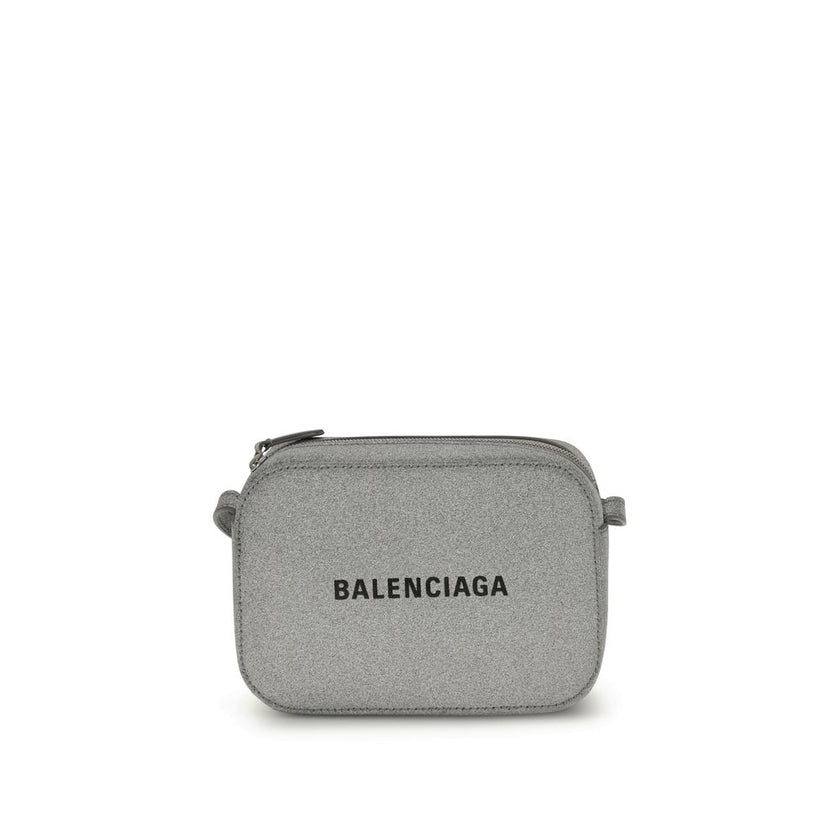 Gray Calf Leather Bos Taurus Shoulder BagSilver Calf XS Everyday Camera Shoulder Bag by Balenciaga, all covered by silver glittered, featuring printed logo on front, zip closure, adjustable shoulder strap, flat pocket at back, large flat pocket inside. Se