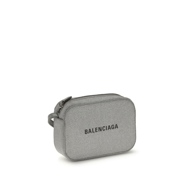Gray Calf Leather Bos Taurus Shoulder BagSilver Calf XS Everyday Camera Shoulder Bag by Balenciaga, all covered by silver glittered, featuring printed logo on front, zip closure, adjustable shoulder strap, flat pocket at back, large flat pocket inside. Se