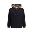 Black Cotton Sweatshirtthe Burberry Cotton Blend Sweatshirt with contrasting Burberry Check hood and calfskin leather details. Featuring a drawstring, kangaroo pockets and ribbed edges, with a relaxed fit for a distinctive casual look. Season: AW22 Fit: O