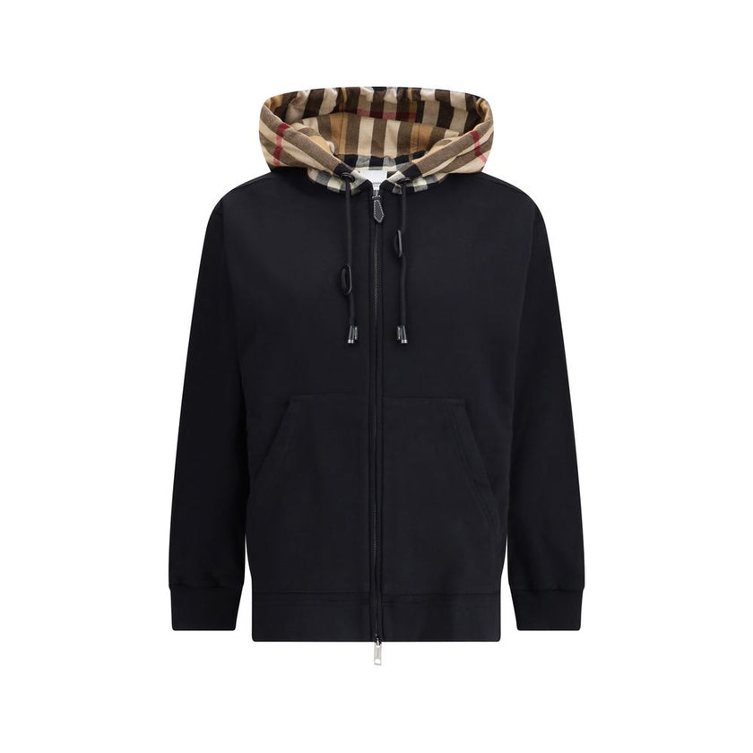 Black Cotton Sweatshirtthe Burberry Cotton Blend Sweatshirt with contrasting Burberry Check hood and calfskin leather details. Featuring a drawstring, kangaroo pockets and ribbed edges, with a relaxed fit for a distinctive casual look. Season: AW22 Fit: O