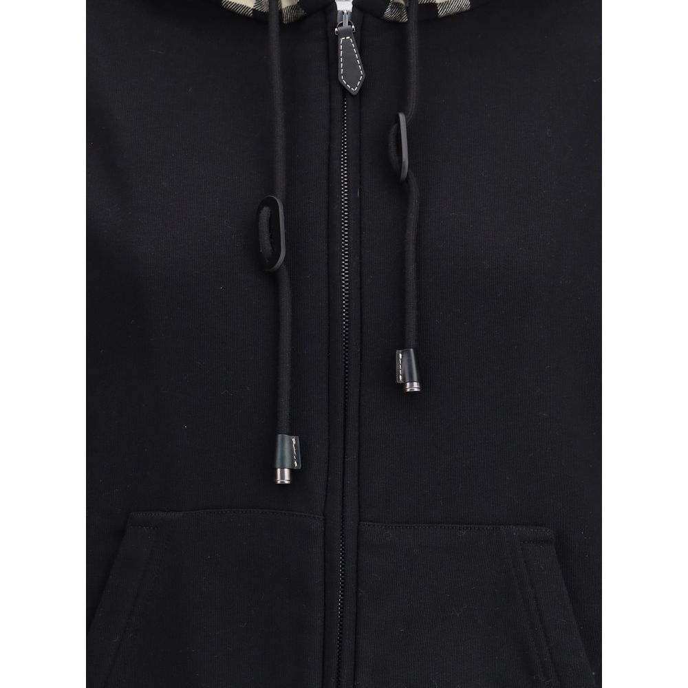 Black Cotton Sweatshirtthe Burberry Cotton Blend Sweatshirt with contrasting Burberry Check hood and calfskin leather details. Featuring a drawstring, kangaroo pockets and ribbed edges, with a relaxed fit for a distinctive casual look. Season: AW22 Fit: O