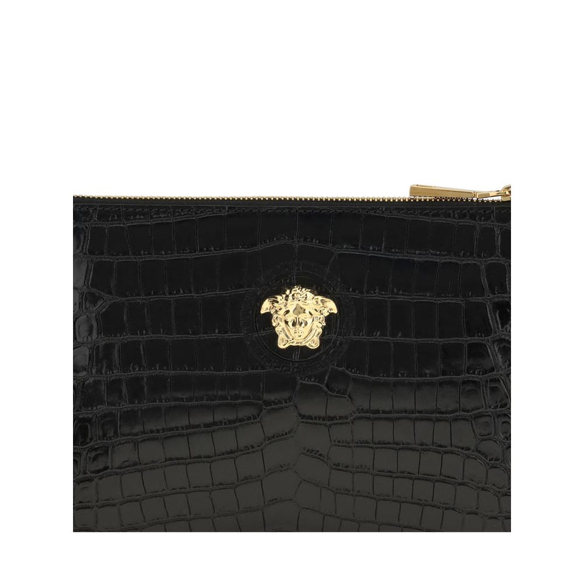 Black Calf Leather Bos Taurus WalletVersace’s crocodile-print Pouch is a sophisticated and gritty accessory. Featuring a top zipper closure, it features a removable side leather puller that allows it to be carried comfortably by hand. The golden Medusa lo