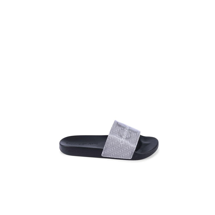 Black Polyurethane SandalsBrand: Calvin Klein Model: YW0YW014030GN Color: Black Composition: 100% Thermoplastic Polyurethane Made in China Designed for Women Material: THERMOPLASTIC POLYURETHANE () Size on Tag: 35Black Polyurethane Sandals${tagsCalvin Kle