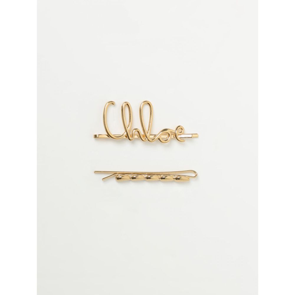 Brown Metal Hair ClipBrand: Chloe Product Type: Hair Accessory Gender: Women Color: Brown Material: Metal Size on Tag: UBrown Metal Hair Clip${tagsChloéBrown Metal Hair ClipBrand: Chloe Product Type: Hair Accessory Gender: Women Color: Brown Material: Met