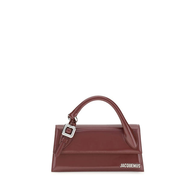 Bordeaux Calf Leather Bos Taurus HandbagThe Chiquito Handbag with Buckle from Jacquemus is a long, structured design made of smooth leather. Featuring a reinforced handle with metal buckle, it has a flap with magnetic closure and an adjustable, removable