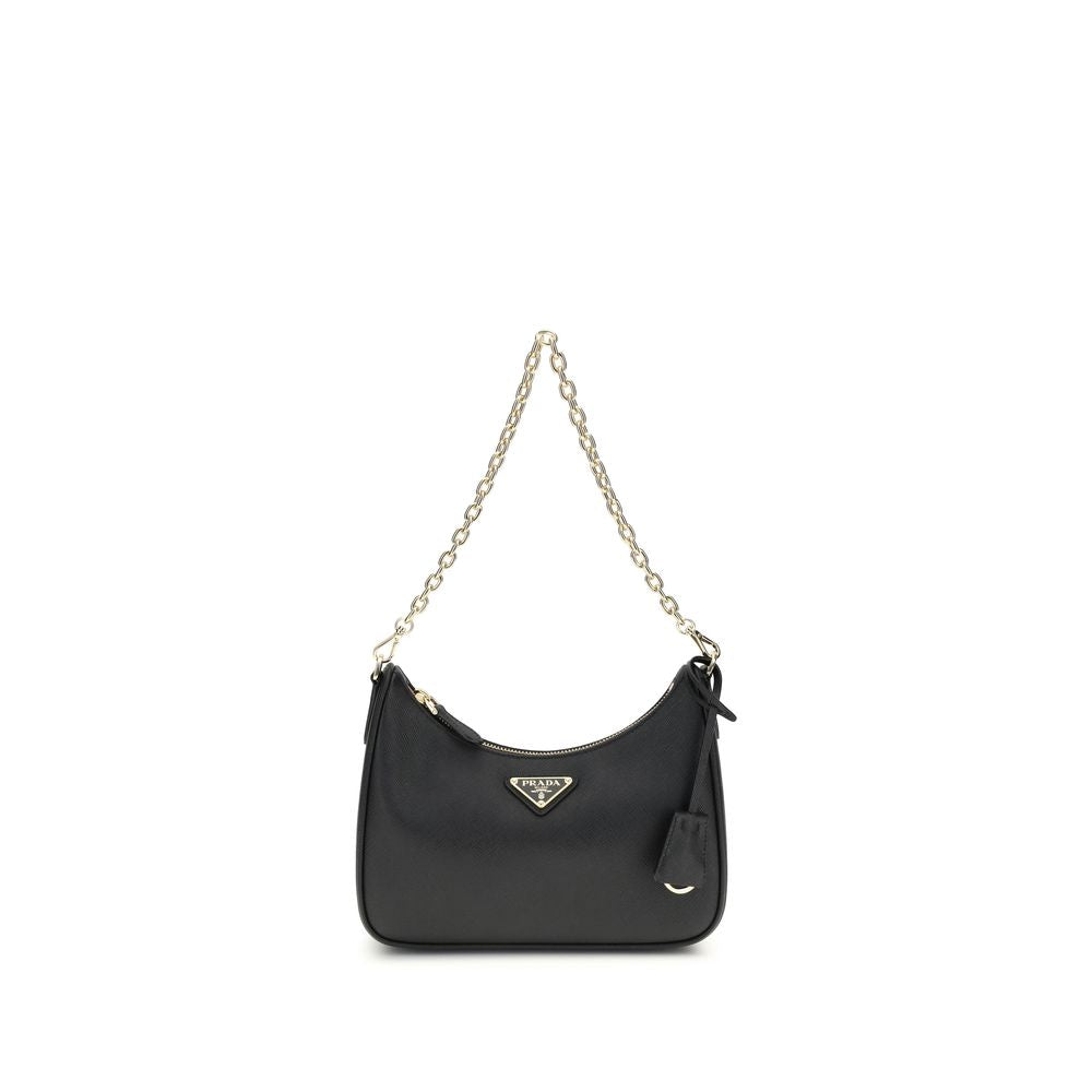 Black Recycled Polyamide Shoulder BagThe 2005 Re-Edition Shoulder Bag by Prada is made of Saffiano leather, with an elegant logoed triangle on the front and a removable leather accessory with key ring. Equipped with a metal chain handle and adjustable ton
