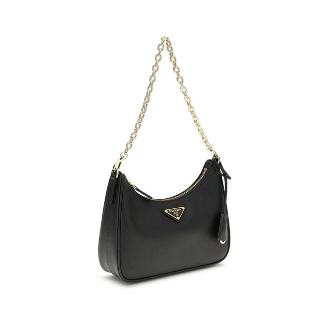 Black Recycled Polyamide Shoulder BagThe 2005 Re-Edition Shoulder Bag by Prada is made of Saffiano leather, with an elegant logoed triangle on the front and a removable leather accessory with key ring. Equipped with a metal chain handle and adjustable ton