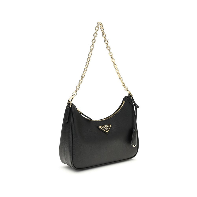 Black Recycled Polyamide Shoulder BagThe 2005 Re-Edition Shoulder Bag by Prada is made of Saffiano leather, with an elegant logoed triangle on the front and a removable leather accessory with key ring. Equipped with a metal chain handle and adjustable ton