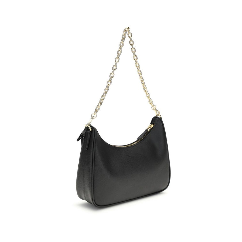 Black Recycled Polyamide Shoulder BagThe 2005 Re-Edition Shoulder Bag by Prada is made of Saffiano leather, with an elegant logoed triangle on the front and a removable leather accessory with key ring. Equipped with a metal chain handle and adjustable ton