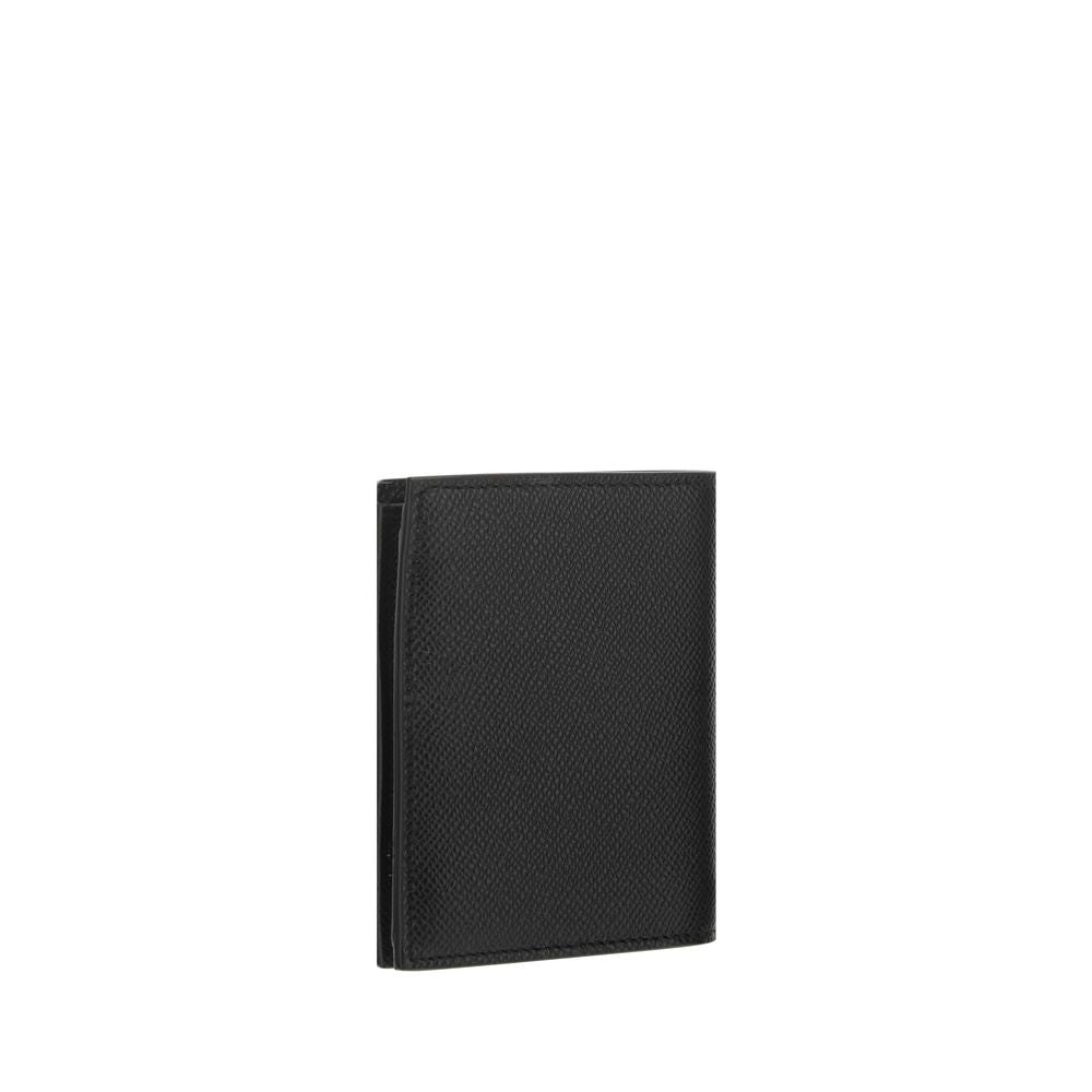 Black Calf Leather Bos Taurus WalletCalfskin Wallet by Ferragamo, interior coin pocket, interior card slot, banknote compartments, brand’s iconic embossed Gancini logo applied to the front, brand signature press-stamped inside. Season: AW25 Dimension: 11x