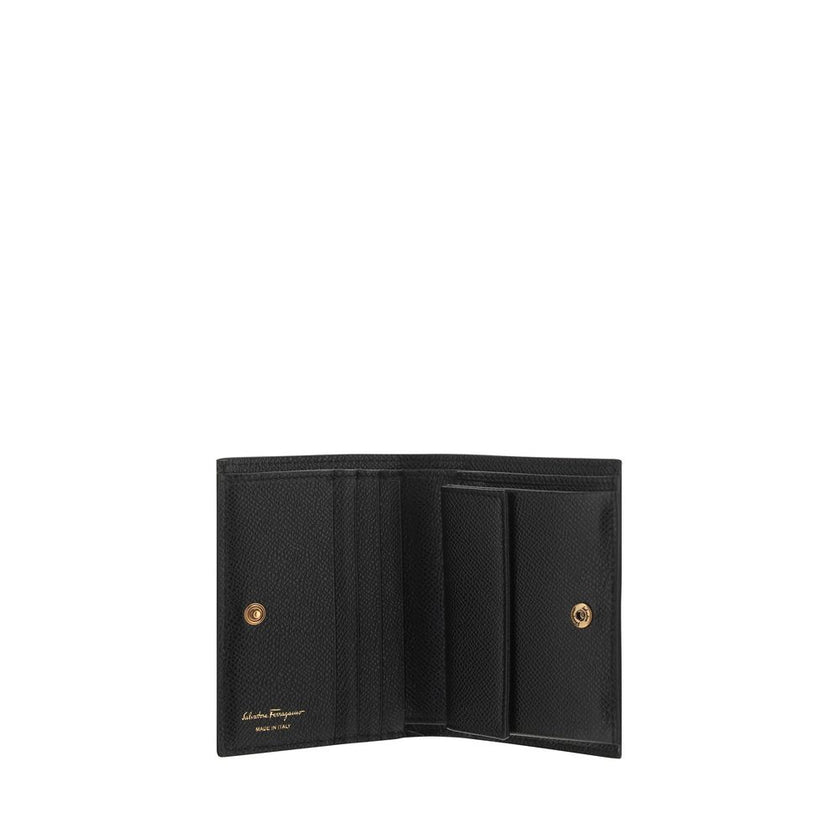 Black Calf Leather Bos Taurus WalletCalfskin Wallet by Ferragamo, interior coin pocket, interior card slot, banknote compartments, brand’s iconic embossed Gancini logo applied to the front, brand signature press-stamped inside. Season: AW25 Dimension: 11x
