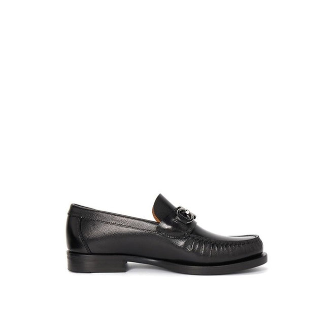 Black Calfskin Slip-On LoafersDescription: – Composition: 100% calf leather – Inner: Leather – Insole: Leather – Sole: Leather – Round toe – Grained-effect – Slip-on design – Glossy trim – Extrawide insole – Silver-tone ‘Gancini’ hardware – Made in Italy