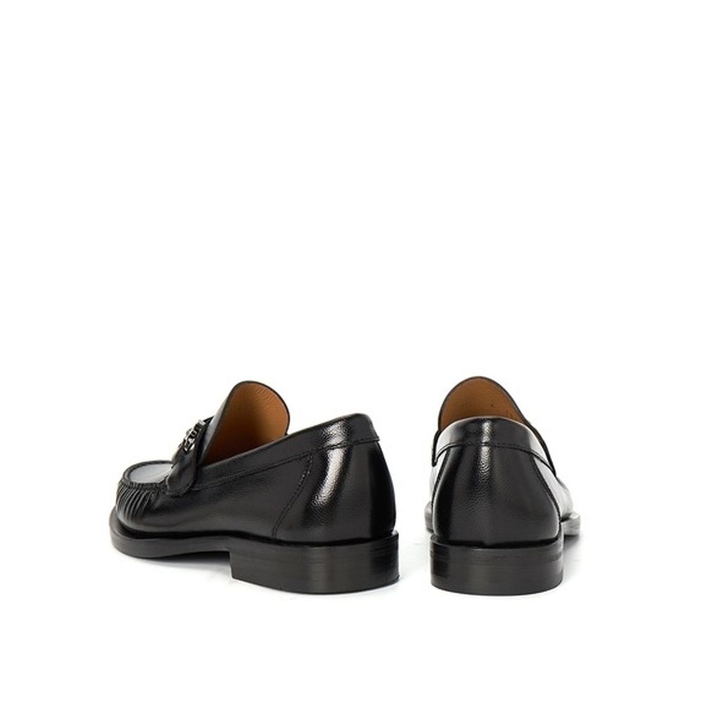 Black Calfskin Slip-On LoafersDescription: – Composition: 100% calf leather – Inner: Leather – Insole: Leather – Sole: Leather – Round toe – Grained-effect – Slip-on design – Glossy trim – Extrawide insole – Silver-tone ‘Gancini’ hardware – Made in Italy