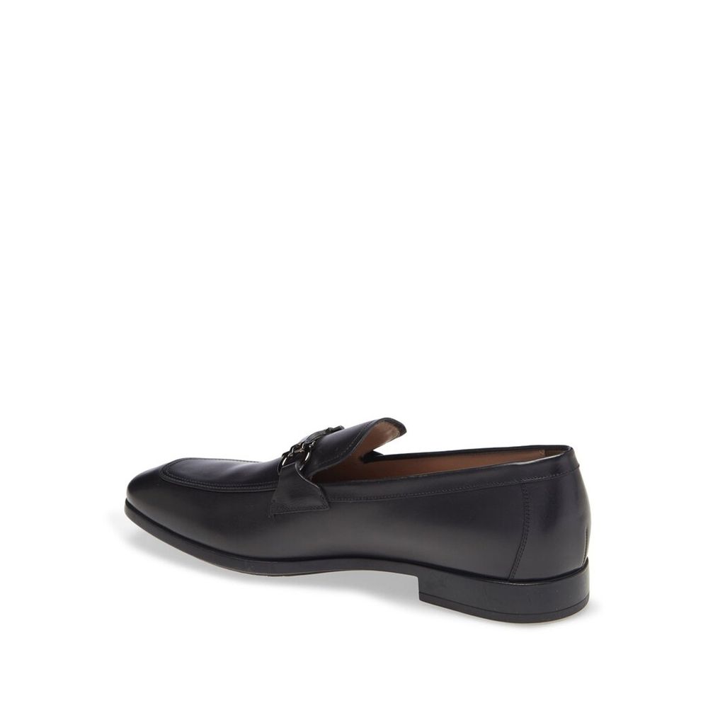 Black Calfskin Slip-On LoafersDescription: – Composition: 100% calf leather – Inner: Leather – Insole: Leather – Sole: Rubber – Branded insole – Almond toe – Top logo hardware – Low stacked heel – Made in Italy – Gender: MEN – Size & Fit: This piece fits