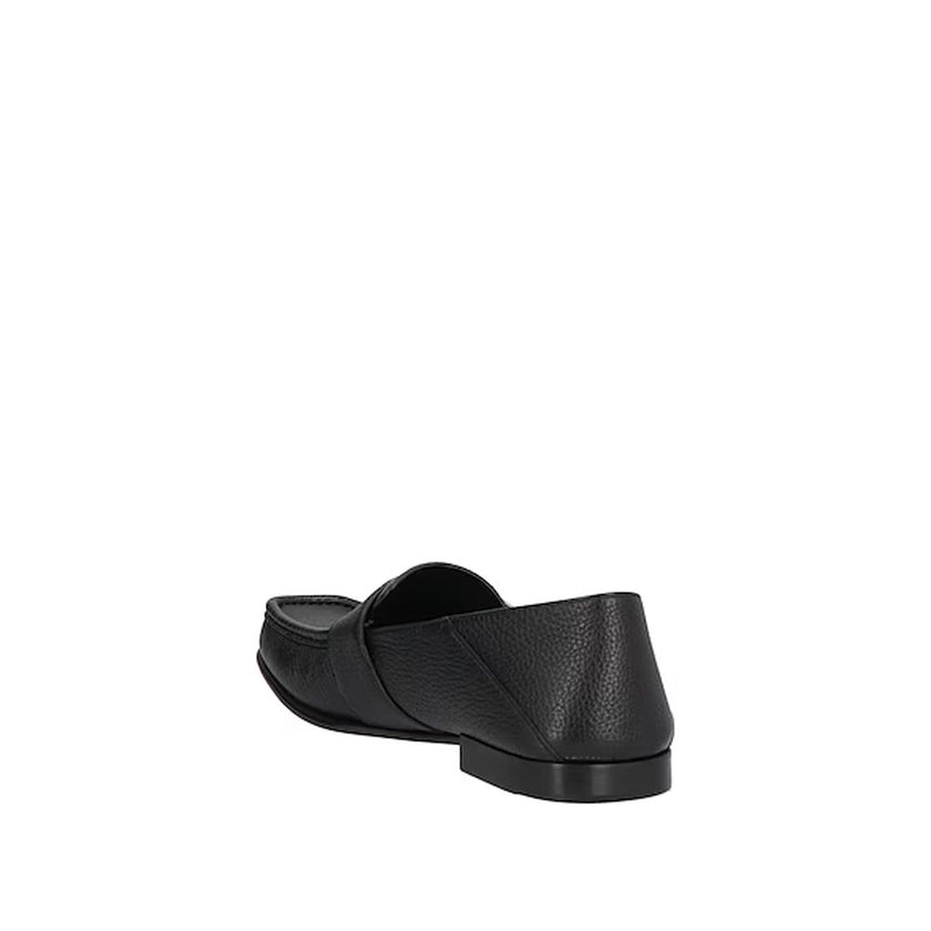 Black Calfskin Slip-On LoafersDescription: – Composition: 100% calf leather – Inner: Leather – Insole: Leather – Sole: Leather – Textured leather – Square toe – Branded insole – Silver-tone metal logo detail – Made in Italy – Gender: MEN –Black Calfskin S