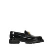 Black Calfskin Slip-On LoafersDescription: – Composition: 100% calf leather – Inner: Leather – Insole: Leather – Sole: Rubber – Round toe – Branded insole – Slip-on design – Gold-tone front logo detail – Smooth leather item – Made in Italy – Gender: MEN –