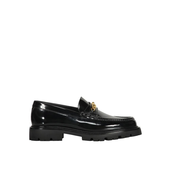 Black Calfskin Slip-On LoafersDescription: – Composition: 100% calf leather – Inner: Leather – Insole: Leather – Sole: Rubber – Round toe – Branded insole – Slip-on design – Gold-tone front logo detail – Smooth leather item – Made in Italy – Gender: MEN –