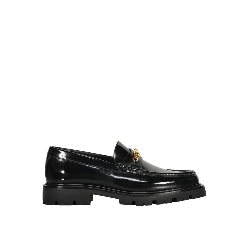 Black Calfskin Slip-On LoafersDescription: – Composition: 100% calf leather – Inner: Leather – Insole: Leather – Sole: Rubber – Round toe – Branded insole – Slip-on design – Gold-tone front logo detail – Smooth leather item – Made in Italy – Gender: MEN –
