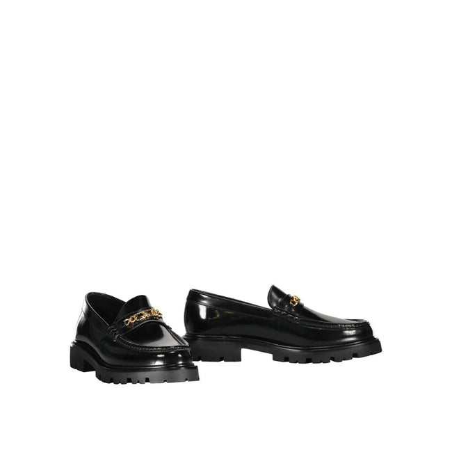 Black Calfskin Slip-On LoafersDescription: – Composition: 100% calf leather – Inner: Leather – Insole: Leather – Sole: Rubber – Round toe – Branded insole – Slip-on design – Gold-tone front logo detail – Smooth leather item – Made in Italy – Gender: MEN –