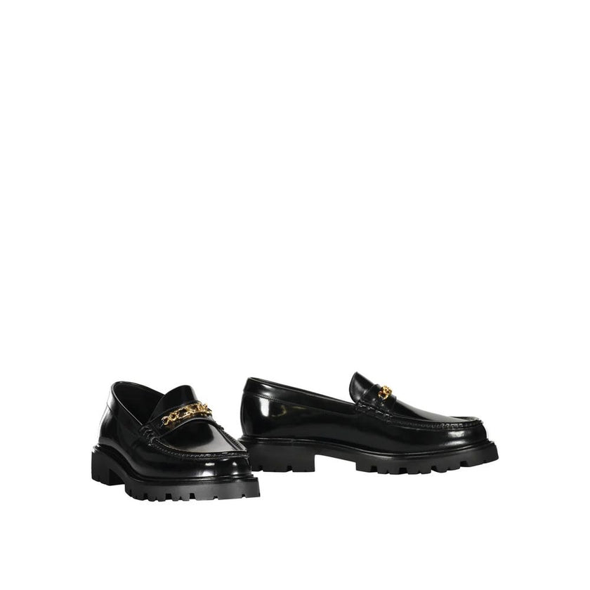 Black Calfskin Slip-On LoafersDescription: – Composition: 100% calf leather – Inner: Leather – Insole: Leather – Sole: Rubber – Round toe – Branded insole – Slip-on design – Gold-tone front logo detail – Smooth leather item – Made in Italy – Gender: MEN –