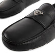 Black Calfskin Slip-On LoafersDescription: – Composition: 100% calf leather – Inner: Leather – Insole: Leather – Sole: Rubber – Round toe – Textured leather – Branded insole – Non-slip knurled sole – Iconic triangular signature brand plaque – Made in Ital