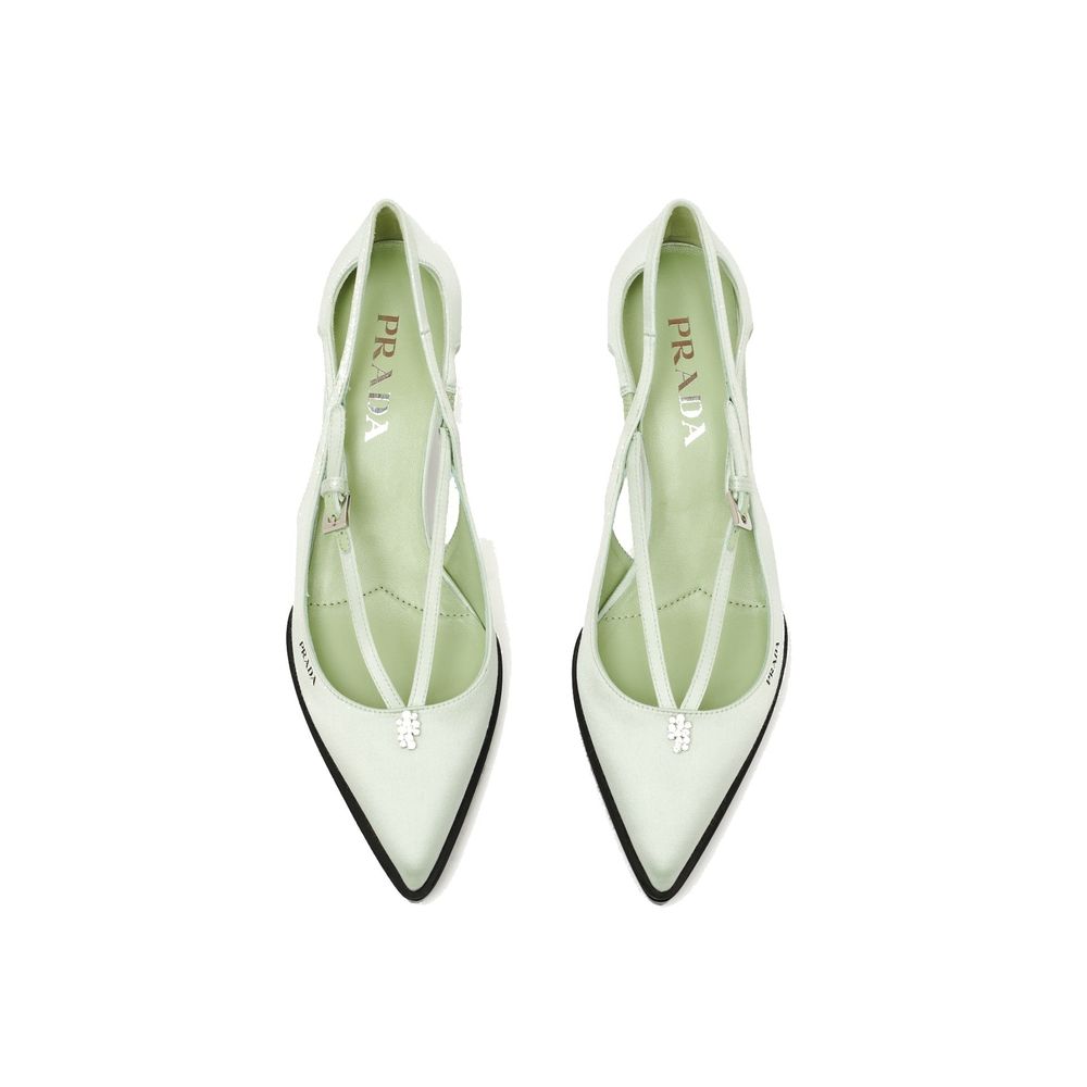 Green Silk Mid Heel PumpsDescription: – Composition: 100% Silk – Inner: Leather – Insole: Leather – Sole: Rubber – Pointed toe – Heel 5,5 cm – Metal buckle closure – Upper with jeweled ornament – Screen-printed logo – Brushed leather-covered heel – Made i