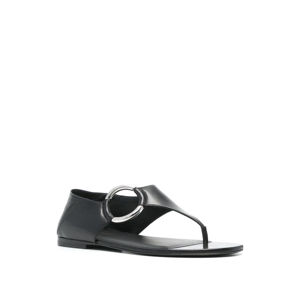 Black Calfskin Strap-On SandalsDescription: – Composition: 100% calf leather – Inner: Leather – Insole: Leather – Sole: Leather – Round toe – Branded insole – Slip-on design – Smooth grain leather – Thong strap – Silver-tone ring hardware detailing – Made