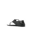 Black Calfskin Strap-On SandalsDescription: – Composition: 100% calf leather – Inner: Leather – Insole: Leather – Sole: Leather – Round toe – Branded insole – Slip-on design – Smooth grain leather – Thong strap – Silver-tone ring hardware detailing – Made