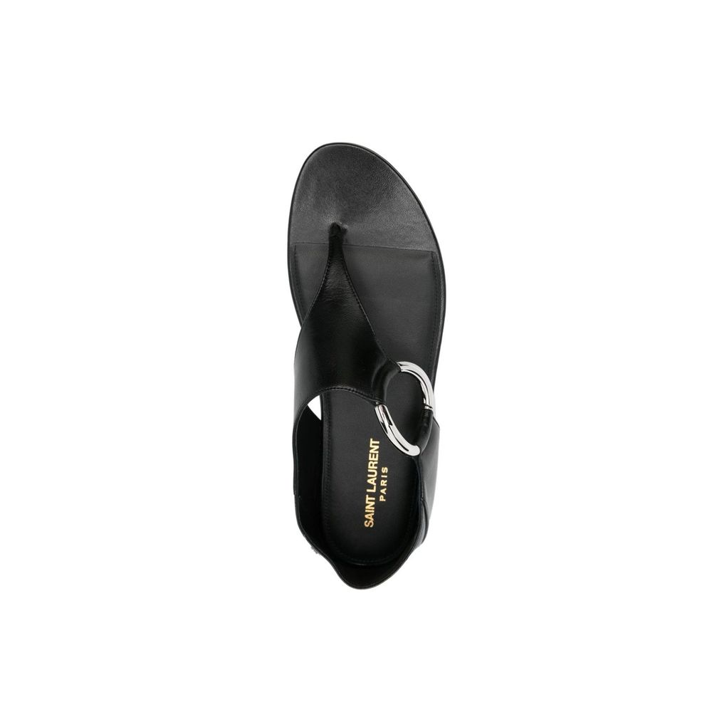 Black Calfskin Strap-On SandalsDescription: – Composition: 100% calf leather – Inner: Leather – Insole: Leather – Sole: Leather – Round toe – Branded insole – Slip-on design – Smooth grain leather – Thong strap – Silver-tone ring hardware detailing – Made