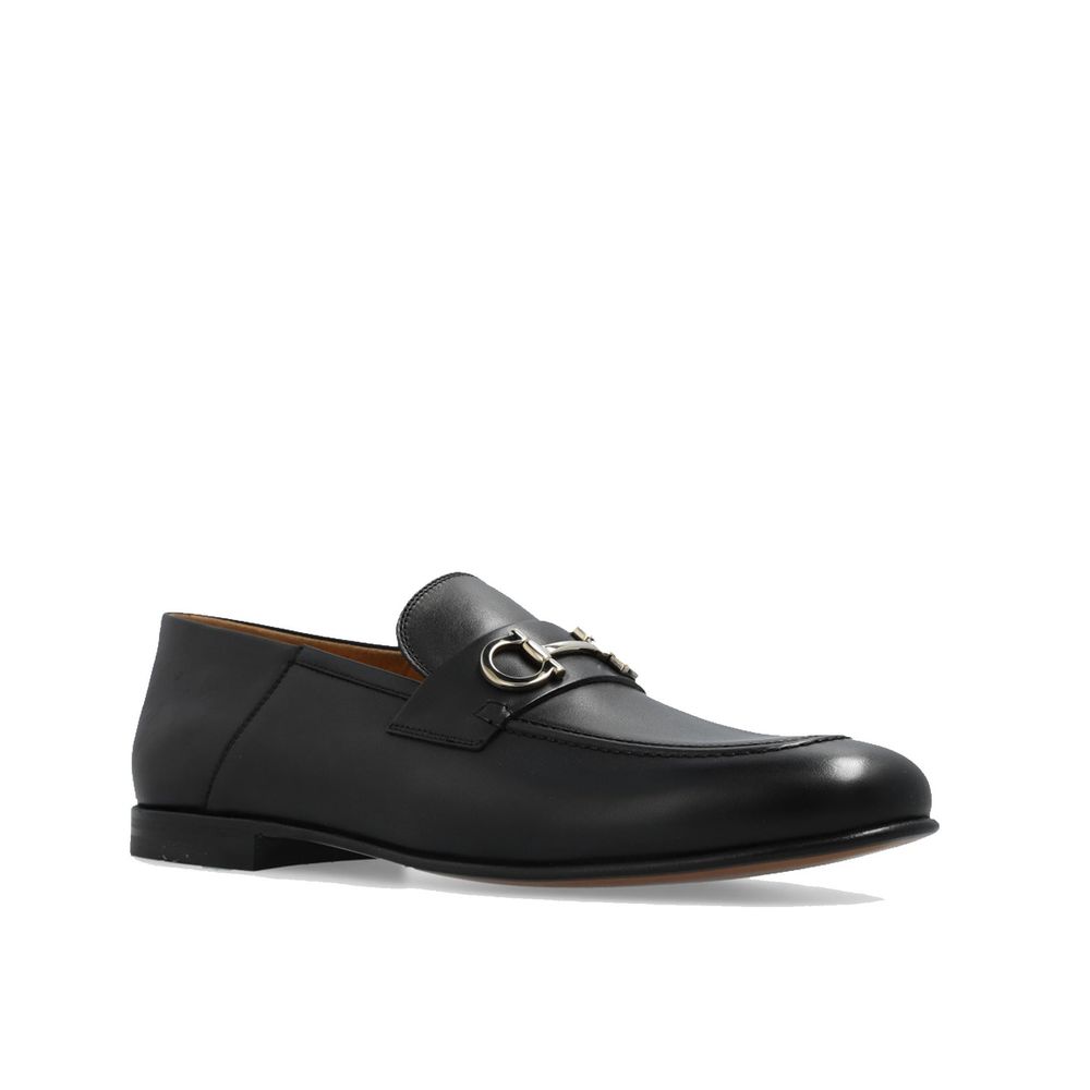 Black Calfskin Slip-On LoafersDescription: – Composition: 100% calf leather – Inner: Leather – Insole: Leather – Sole: Leather – Top metal hardware – Almond toe – Made in Italy – Gender: MEN –Black Calfskin Slip-On Loafers${tagsSalvatore FerragamoBlack Ca