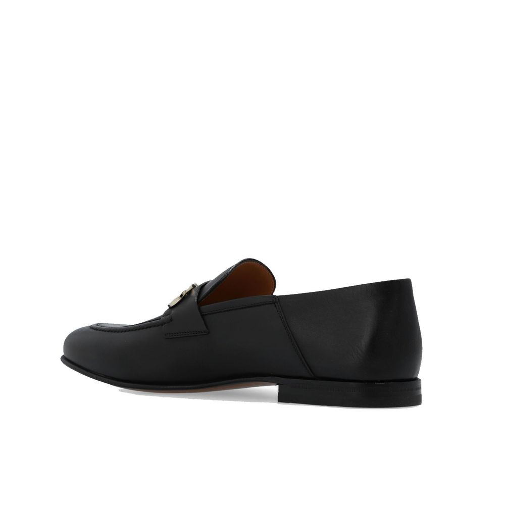 Black Calfskin Slip-On LoafersDescription: – Composition: 100% calf leather – Inner: Leather – Insole: Leather – Sole: Leather – Top metal hardware – Almond toe – Made in Italy – Gender: MEN –Black Calfskin Slip-On Loafers${tagsSalvatore FerragamoBlack Ca