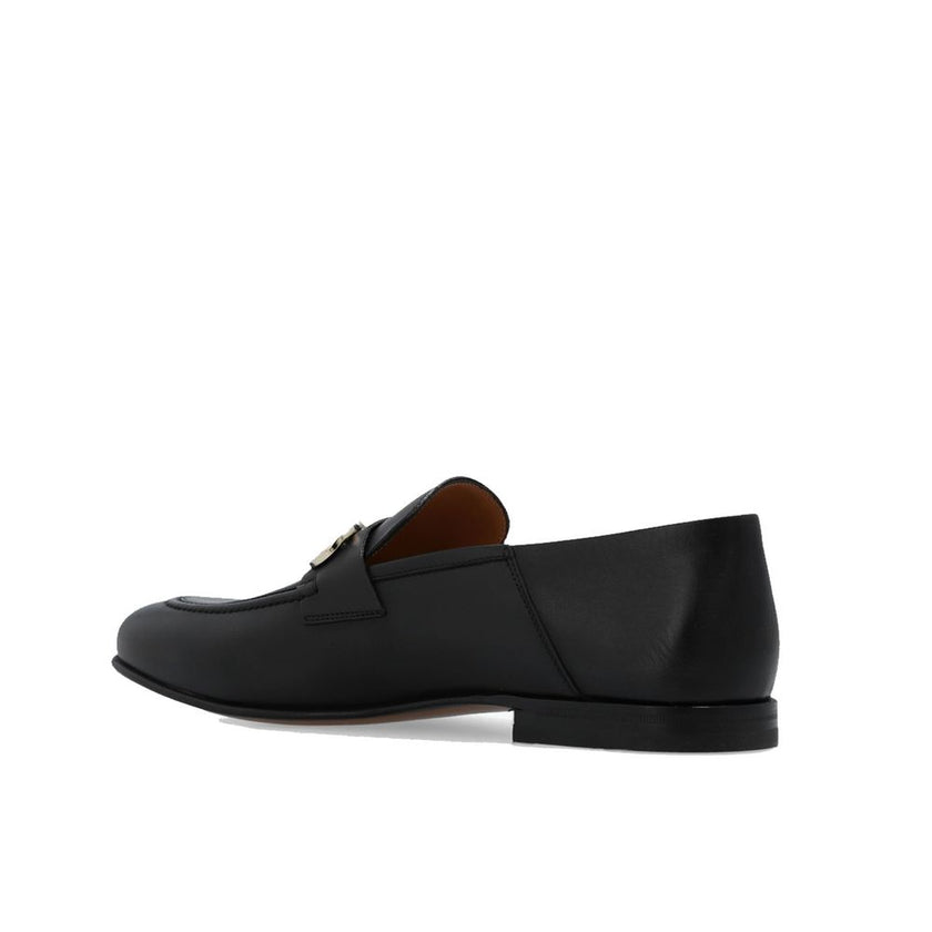 Black Calfskin Slip-On LoafersDescription: – Composition: 100% calf leather – Inner: Leather – Insole: Leather – Sole: Leather – Top metal hardware – Almond toe – Made in Italy – Gender: MEN –Black Calfskin Slip-On Loafers${tagsSalvatore FerragamoBlack Ca