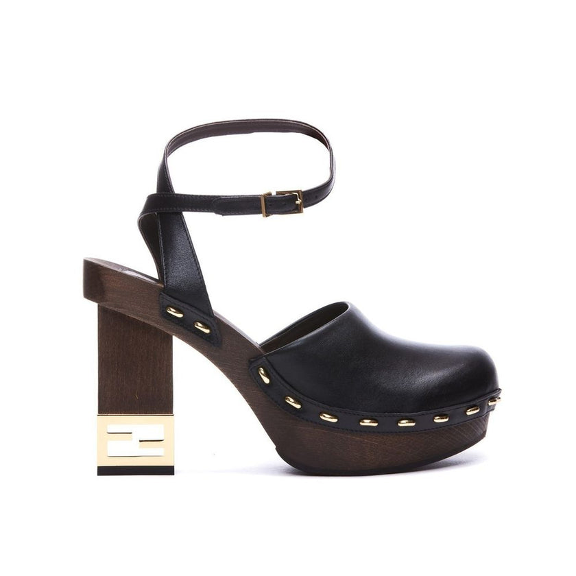 Black Calfskin ClogsDescription: – Composition: 100% calf leather – Inner: Leather – Insole: Leather – Sole: Rubber – Heel: 9.5 cm / 24.13 in – Round toe – Made in Italy – Logo ankle buckle closure – Gold-tone decorative heel – Gender: WOMEN –Black Calfsk
