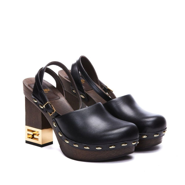 Black Calfskin ClogsDescription: – Composition: 100% calf leather – Inner: Leather – Insole: Leather – Sole: Rubber – Heel: 9.5 cm / 24.13 in – Round toe – Made in Italy – Logo ankle buckle closure – Gold-tone decorative heel – Gender: WOMEN –Black Calfsk