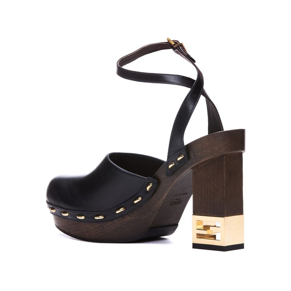 Black Calfskin ClogsDescription: – Composition: 100% calf leather – Inner: Leather – Insole: Leather – Sole: Rubber – Heel: 9.5 cm / 24.13 in – Round toe – Made in Italy – Logo ankle buckle closure – Gold-tone decorative heel – Gender: WOMEN –Black Calfsk