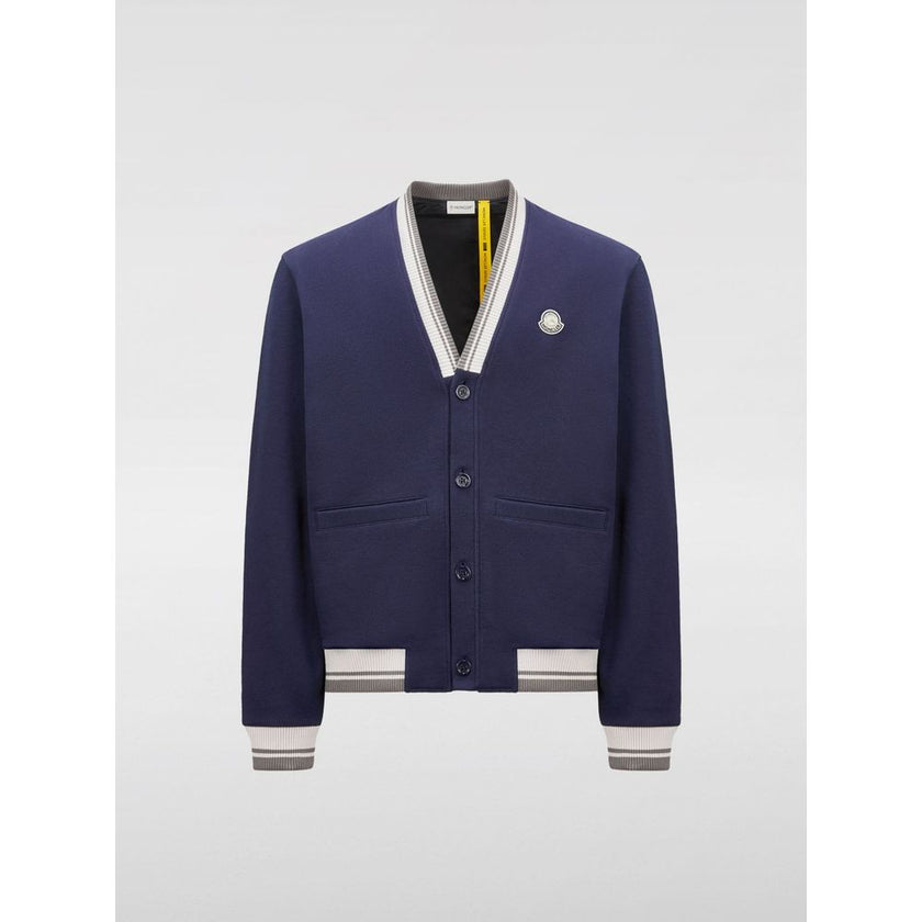 Blue Cotton BomberDesigned for men Made by Moncler Blue color Ideal for casual wear Great for layering Material: Cotton blend ribbed trims Size on Tag: LBlue Cotton Bomber${tagsMonclerBlue Cotton BomberDesigned for men Made by Moncler Blue color Ideal for