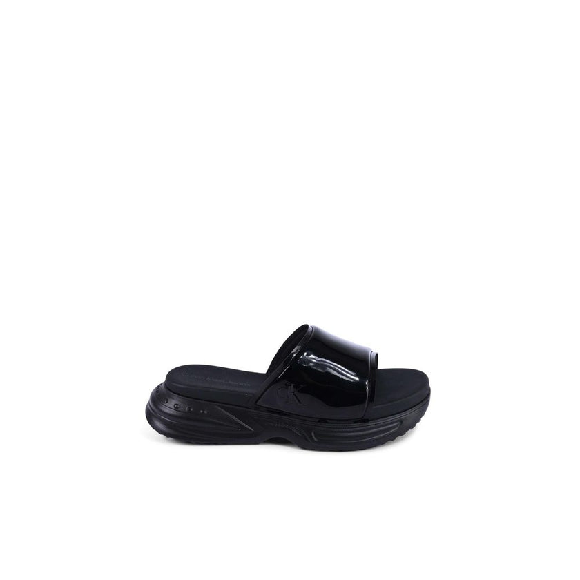 Black Polyurethane SlidesBrand: Calvin Klein Model: YW0YW014040GT Colour: Black Composition: 100% Thermoplastic Polyurethane Made in China Suitable for: WomenBlack Polyurethane Slides${tagsCalvin KleinBlack Polyurethane SlidesBrand: Calvin Klein Model: YW