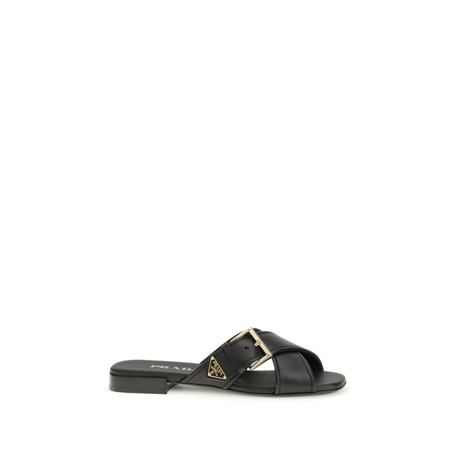Black Calf Leather Bos Taurus Flat SandalsThe leather Sandals by Prada combine elegance and modernity in an essential yet distinctive design. The buckled crisscross straps enhance the foot with balance and sophistication, while the micro block heel offers