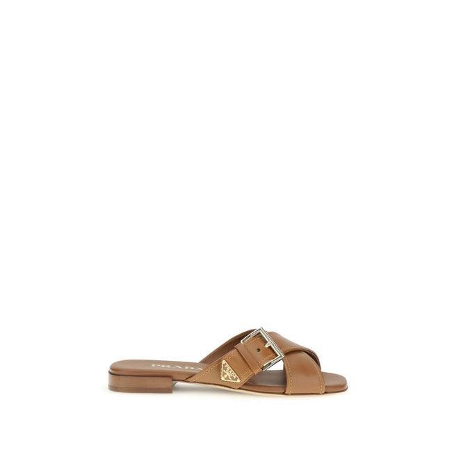 Brown Calf Leather Bos Taurus Flat SandalsThe leather Sandals by Prada combine elegance and modernity in an essential yet distinctive design. The buckled crisscross straps enhance the foot with balance and sophistication, while the micro block heel offers