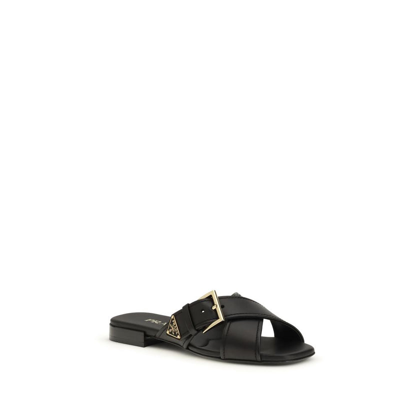 Black Calf Leather Bos Taurus Flat SandalsThe leather Sandals by Prada combine elegance and modernity in an essential yet distinctive design. The buckled crisscross straps enhance the foot with balance and sophistication, while the micro block heel offers