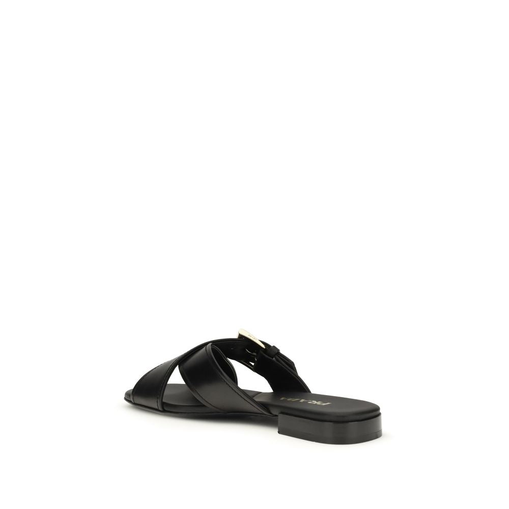 Black Calf Leather Bos Taurus Flat SandalsThe leather Sandals by Prada combine elegance and modernity in an essential yet distinctive design. The buckled crisscross straps enhance the foot with balance and sophistication, while the micro block heel offers