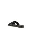 Black Calf Leather Bos Taurus Flat SandalsThe leather Sandals by Prada combine elegance and modernity in an essential yet distinctive design. The buckled crisscross straps enhance the foot with balance and sophistication, while the micro block heel offers
