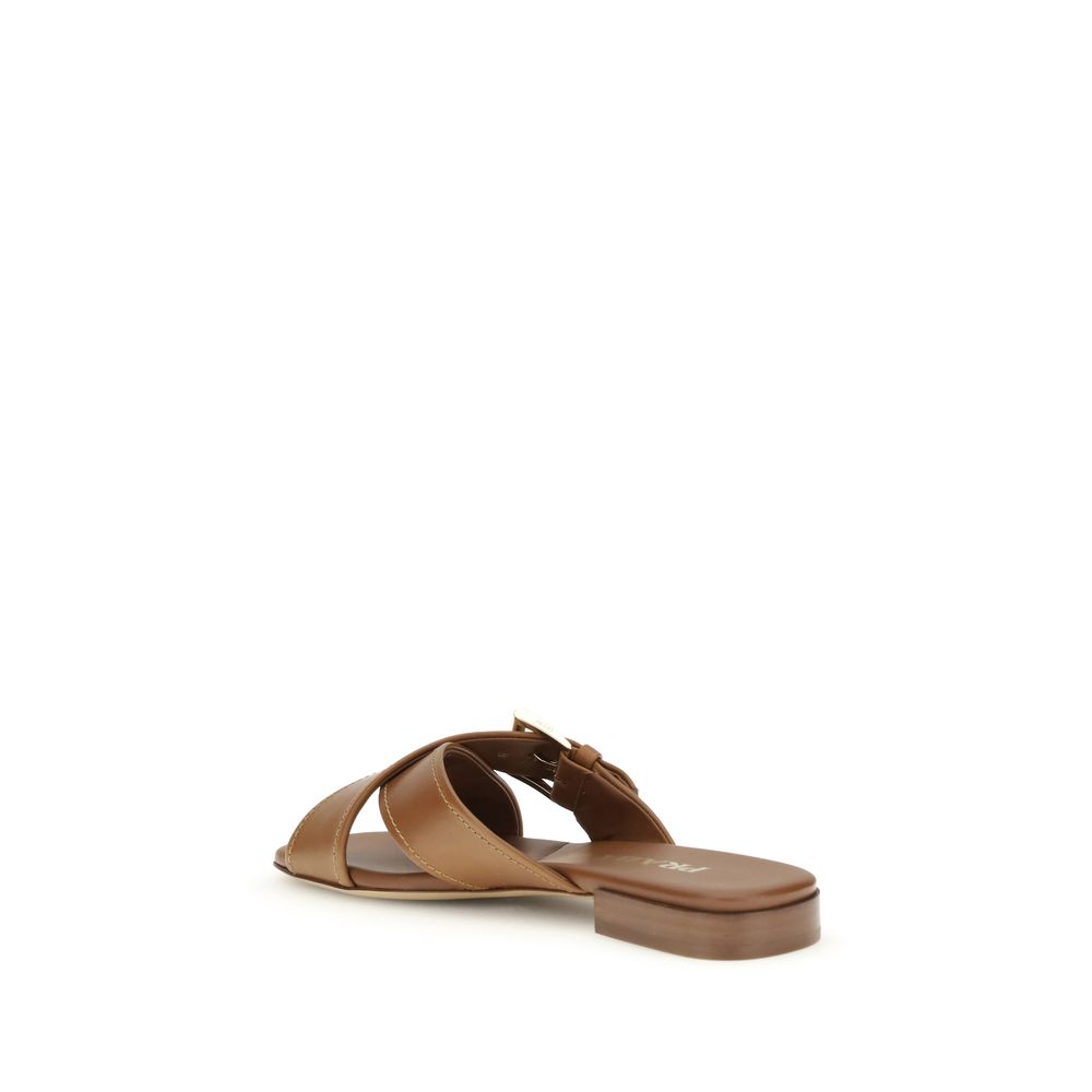 Brown Calf Leather Bos Taurus Flat SandalsThe leather Sandals by Prada combine elegance and modernity in an essential yet distinctive design. The buckled crisscross straps enhance the foot with balance and sophistication, while the micro block heel offers