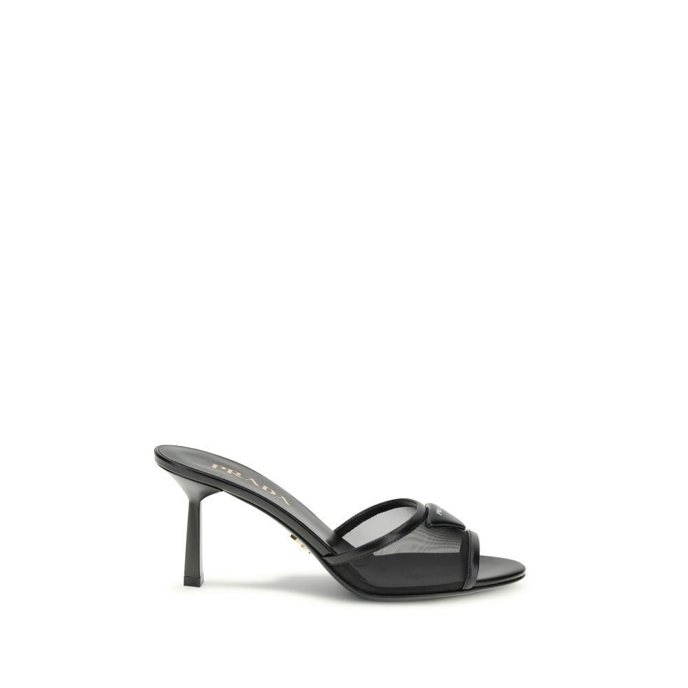 Black Calf Leather Bos Taurus Stiletto Heel SandalsThe mesh slipper Sandals by Prada combine lightness and contemporary style in a sophisticated design. The mesh strap is accented by the iconic triangular leather logo plaque, while the stiletto heel lends