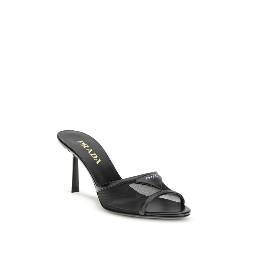 Black Calf Leather Bos Taurus Stiletto Heel SandalsThe mesh slipper Sandals by Prada combine lightness and contemporary style in a sophisticated design. The mesh strap is accented by the iconic triangular leather logo plaque, while the stiletto heel lends