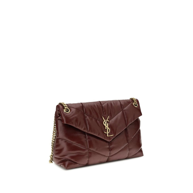 Bordeaux Calf Leather Bos Taurus Shoulder BagThe medium Puffer Bag in glossy leather by Yves Saint Laurent reimagines the iconic Loulou with a contemporary, sensual twist. Crafted from shiny leather with chevron-quilted stitching, it combines softness and