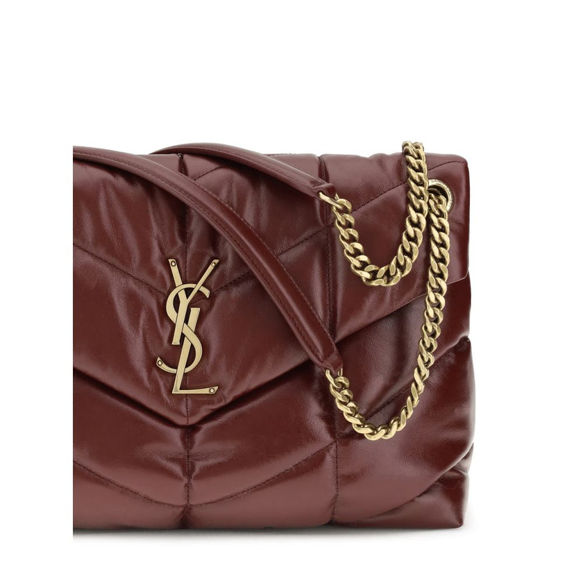 Bordeaux Calf Leather Bos Taurus Shoulder BagThe medium Puffer Bag in glossy leather by Yves Saint Laurent reimagines the iconic Loulou with a contemporary, sensual twist. Crafted from shiny leather with chevron-quilted stitching, it combines softness and