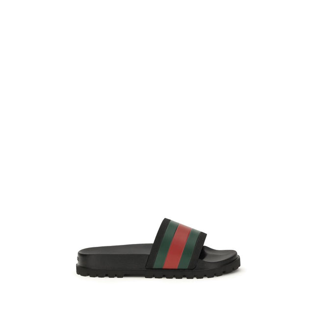 Black Rubber SlippersThe rubber Slippers by Gucci are part of the Gucci Lido line and reinterpret one of the Maison’s most iconic symbols in a pop twist: the green and red Web ribbon. Made of black rubber and featuring a slip-on design, they combine comfo