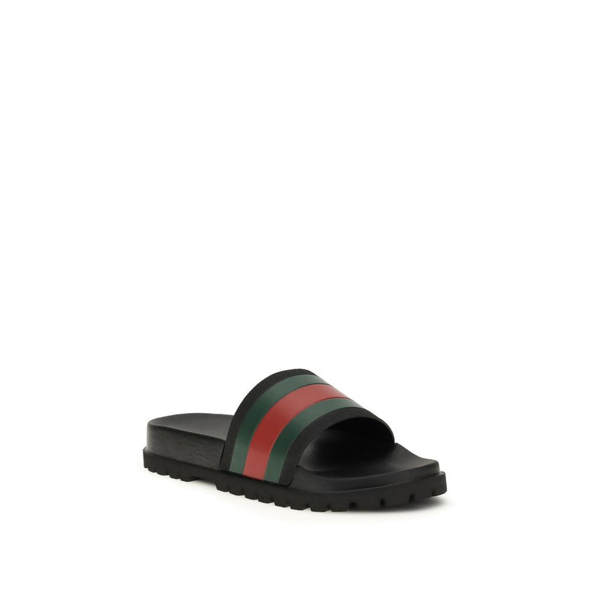 Black Rubber SlippersThe rubber Slippers by Gucci are part of the Gucci Lido line and reinterpret one of the Maison’s most iconic symbols in a pop twist: the green and red Web ribbon. Made of black rubber and featuring a slip-on design, they combine comfo