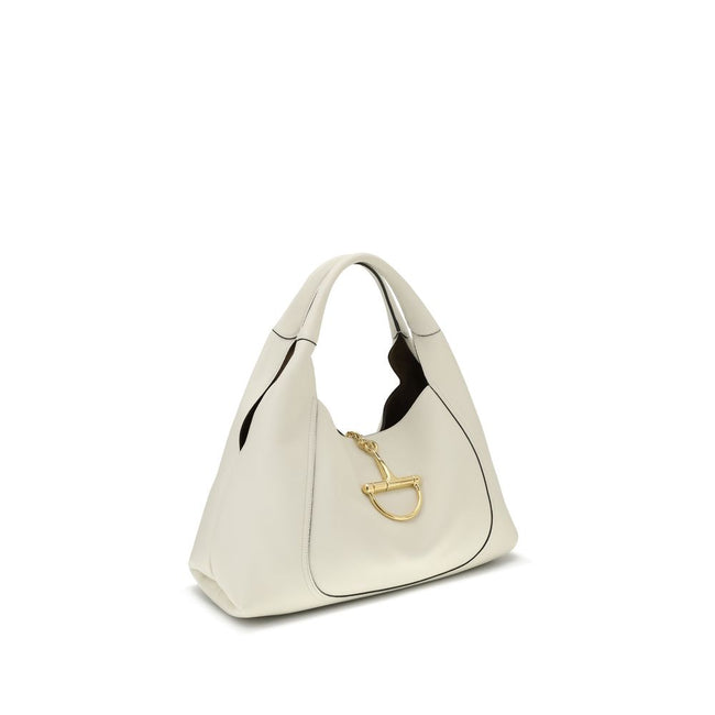 White Calf Leather Bos Taurus Shoulder BagThe Softbit maxi Shoulder Bag by Gucci is an imposing and elegant accessory, ideal for those seeking space and style. Crafted in refined black grained leather, it offers rich texture and lasting strength. Gold-ton